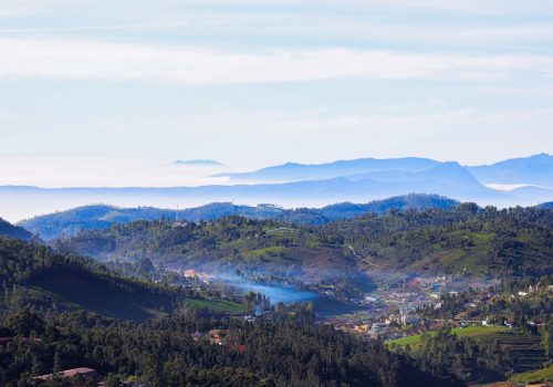 A breathtaking aerial capture of Ooty's lush green hills and serene landscape.