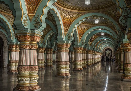 Stunning ornate arches and columns inside the historic Mysore Palace in Karnataka, India.